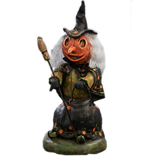 Witch of the Woods figurine has a pumpkin head long nose and a witches&
