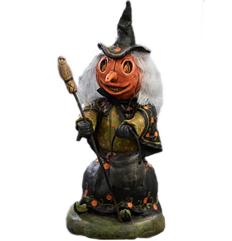 Witch of the Woods figurine has a pumpkin head long nose and a witches' hat and broomstick