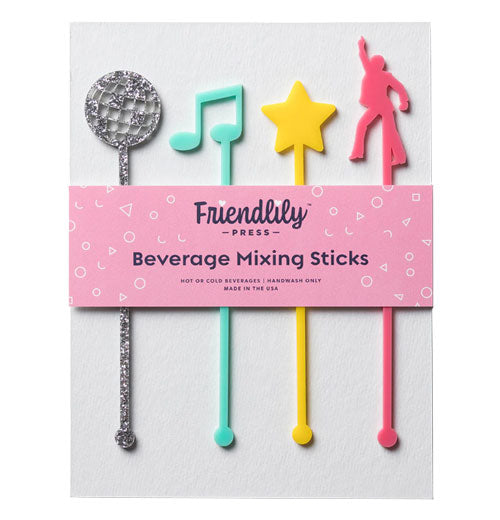 A set of 4 plastic drink stirrers that all have unique shapes depicting stuff you would find at a 1970s disco party. From left to right you have a silver disco ball, an aqua music note, a yellow star, and a pink figure doing the Saturday Night Fever dance. They are shown in their packaging. All have a little nob at the bottom.