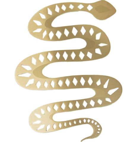 A brass, snake shaped bookmark with geometric designs goes back and forth.