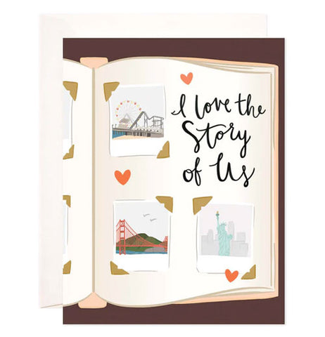 A card with an auburn brown colored background and a cut off open book printed on it that is open with pictures of different places like the statue of liberty, the golden gate bridge, and a ferris wheel with the words I love the story of us.