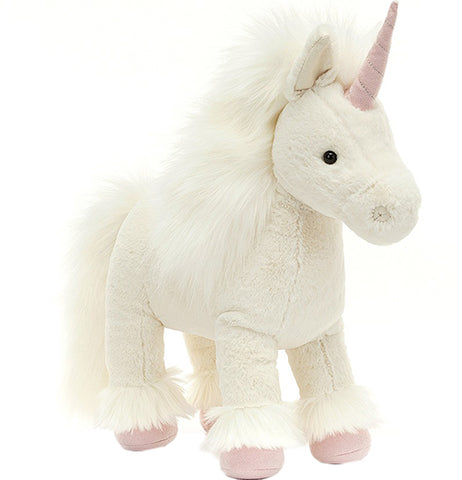 A creamy white unicorn with pink hooves and horn stands at an angle.