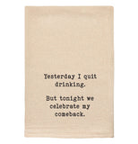 A beige tea towel with black text reading "Yesterday I quit drinking. But tonight we celebrate my comeback."