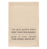 A beige tea towel with black text reading "I'm just gonna wear what I want this summer. And if you think I look chubby, well so do I." A dotted line is between the two sentences.