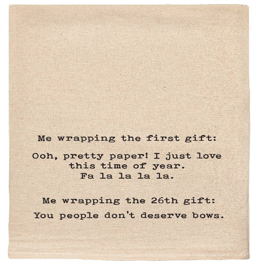 Me wrapping the first gift: Ooh pretty paper! tea towel