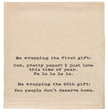 Me wrapping the first gift: Ooh pretty paper! tea towel