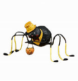 The Willie Web Weaver that has a figure of a black spider carrying a Halloween pumpkin basket. 