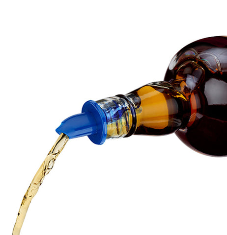 The contents of an olive oil bottle are shown being poured with the blue pourer.