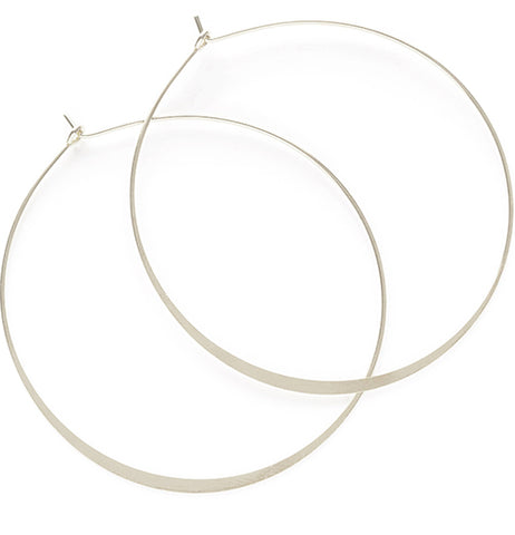 Two silver hoop earrings overlapping each other in a way that imitates a Venn diagram.