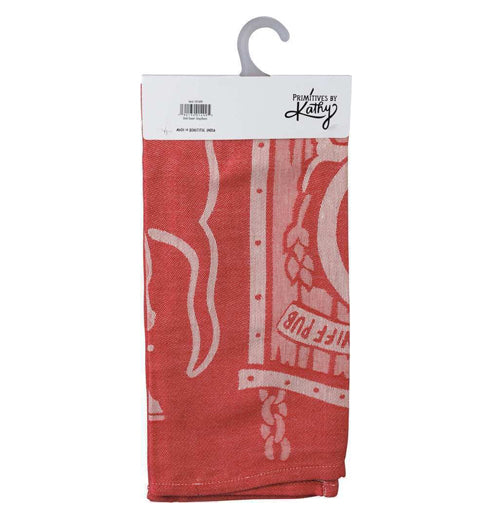 The back of the red dish towel is shown with part of the sign and the dog&