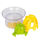 The 2-in-1 "Juicerster Jr." Citrus Juicer taken apart  with the juicer, the green reamer, and the yellow reamer. 