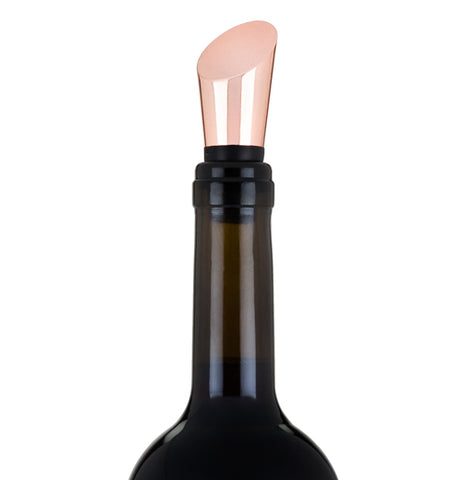 The copper bottle stopper is shown closing a wine bottle.
