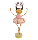 This human figurine is of a girl with black hair in pigtails wearing a pink ballet tutu.