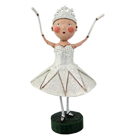 This snow queen is with her tiara and a white dress and holding her hands up.