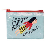 A woman in a red shirt and a yellow and black skirt flying through a blue sky and with the saying "I'm having a out of money experience" with a red zipper