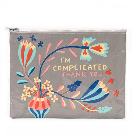A gray bag with a gray zipper with the picture of a vase with flowers sprouting from it and the words "I'm Complicated Thank you".
