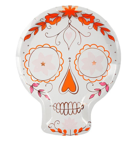 The "Sugar Skull" paper plate has a design of a traditional sugar skull with orange, pink, and copper floral designs outlining the skull's features. 