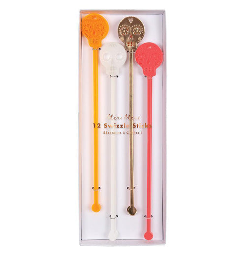 The 12 "Sugar Skull" swizzle sticks features a colored sugar skull design on top of a stir stick with four colors of red, gold foil, white, and orange. 