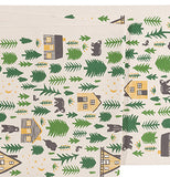 This is a close up of the cabin, bear, and forest design covering the table cloth.
