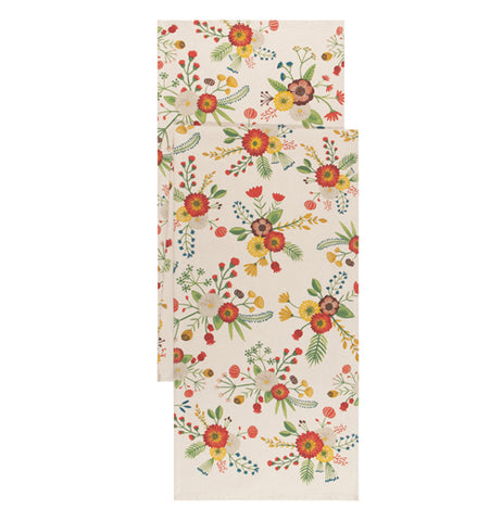 This cream colored table runner has a design of red, purple, and yellow flowers covering it.