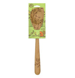 The wooden spoon is in a green cardboard package