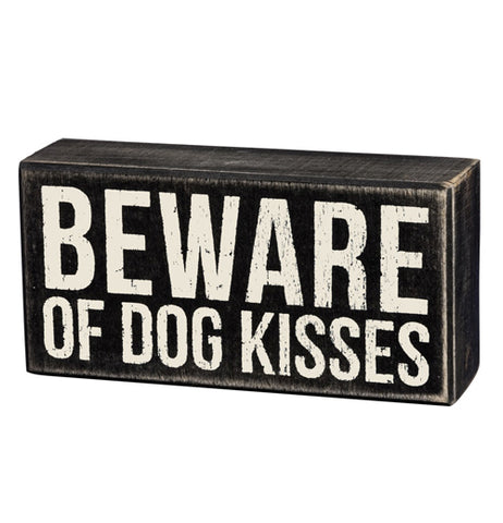 This small black wooden box depicts the words, "Beware of Dog Kisses" in its center.