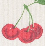 This is a close-up of three of the cherries on the dishcloth.