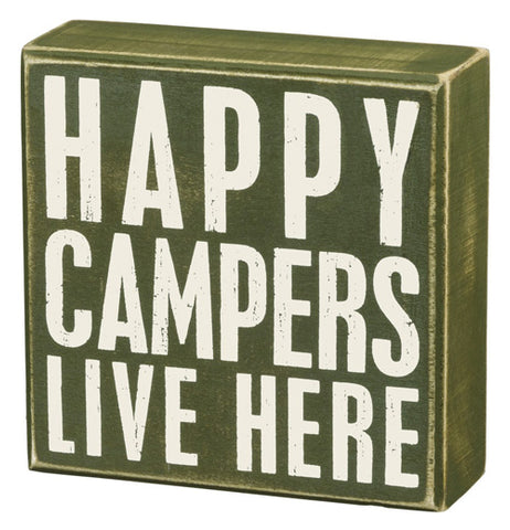 The "Happy Campers" Box Sign has white letters that say "Happy Campers live here" over a green background.