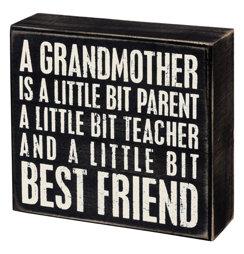 This black box sign has the words, "A Grandmother Is A Little Bit Parent A Little Bit Teacher And A Little Bit Best Friend" in white lettering.