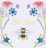 A close up of the bee with the flowers on either side is shown with text above the bee that says "Bee Kind".