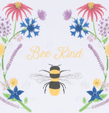 A close up of the bee with the flowers on either side is shown with text above the bee that says "Bee Kind".