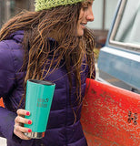 The lid is shown sealing the top of a teal green water bottle held by a woman in a purple parka vest and a green hat.