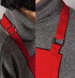 Someone wearing the red  Chef Apron with an adjustable neck strap.