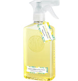A clear bottle has yellow surface cleaner in it, a silver-colored and white plastic top, and a blue, yellow, and white label sticker and hangtag.