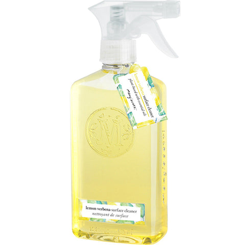 A clear bottle has yellow surface cleaner in it, a silver-colored and white plastic top, and a blue, yellow, and white label sticker and hangtag.