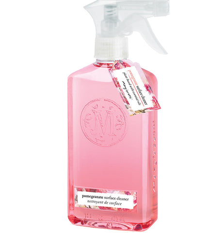 A clear bottle has red or pink soap in it, a silver-colored and white plastic top, and a red, pink and white label sticker and hangtag.