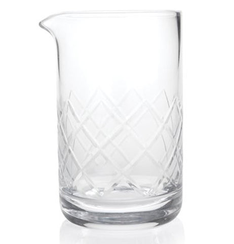 This glass with a pouring spout has a crisscross pattern of striations running all around it.