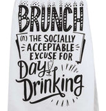 This close-up is of the white dish towel containing the black text saying, "Brunch The Socially Acceptable Excuse For Day Drinking" on it.