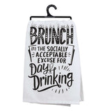 This white dish towel on a hanger containing a black text saying, "Brunch, The Socially Acceptable Excuse for Day Drinking" on it.