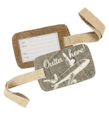 A luggage tag with an airplane that says Outta Here