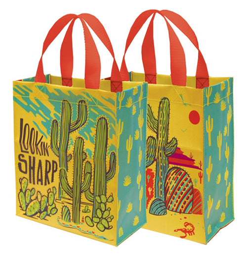 A yellow and blue desert themed tote featuring a variety of different cacti along with the phrase "Lookin&