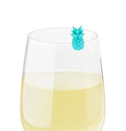The teal drink charm is shown attached to a wine glass filled with white wine.