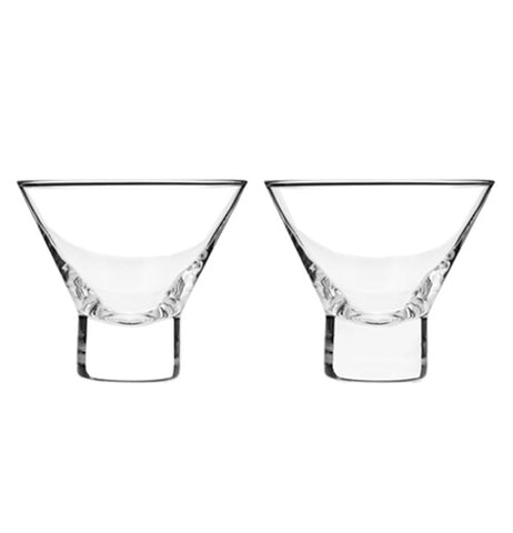 Two clear stemless martini glasses sitting next to each other on a white background.