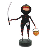 The figure of the Lil' Ninja warrior wears black and carries a sword in one hand and a Halloween basket on the other. 