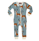 These blue pajamas have a white zipper, cuffs and collar and have brown and white bucks with black antlers from top to bottom designed on them. 