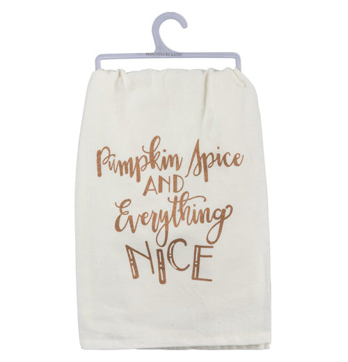 The "Pumpkin Spice" dish towel has copper metallic lettering that reads "Pumpkin Spice and Everything Nice" over a white background. 