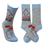 The gray socks with the roses in the measuring cup are shown from the side and front angles.