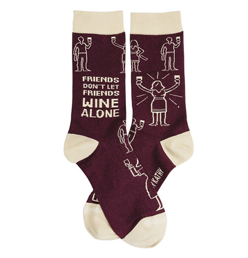 The "Wine Alone" pair of socks has one sock which has the text "Friends Don&
