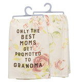 These are two sides of the same floral print towel. The Front reads "Only the Best Moms get promoted to grandma" in brown lettering. The back has a pink floral print on a white background.