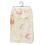 The back of the towel has a floral print of roses and leaves on a white background.